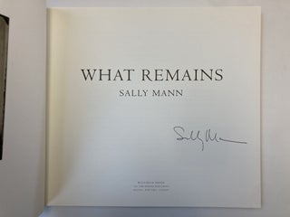 WHAT REMAINS [SIGNED]