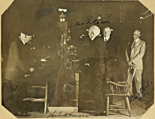 1371166 THOMAS EDISON, HENRY FORD, AND HERBERT HOOVER SIGNED PRESS PHOTOGRAPH. Thomas Edison,...