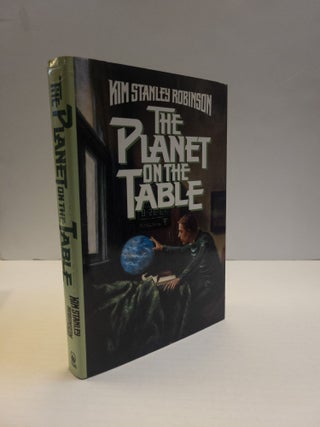 1376904 THE PLANET ON THE TABLE [Inscribed]. Kim Stanley Robinson