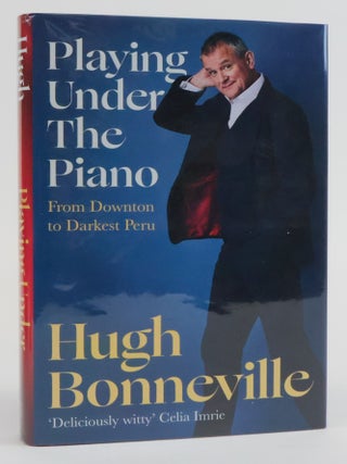 1382688 PLAYING UNDER THE PIANO; FROM DOWNTOWN TO DARKEST PERU [Signed]. Hugh Bonneville
