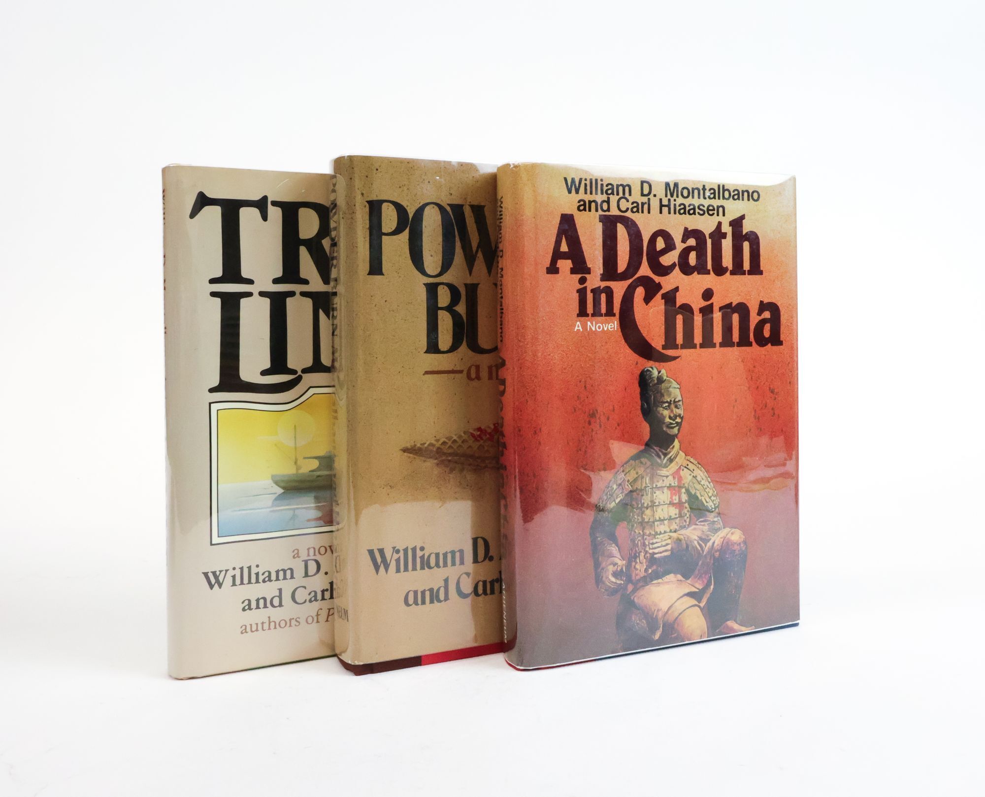 1385087 THE BLACK LIZARD SERIES: POWDER BURN [with] TRAP LINE [and] A DEATH IN CHINA [Three Books] [Two Volumes Signed by Hiaasen]. William D. Montalbano, Carl Hiaasen.