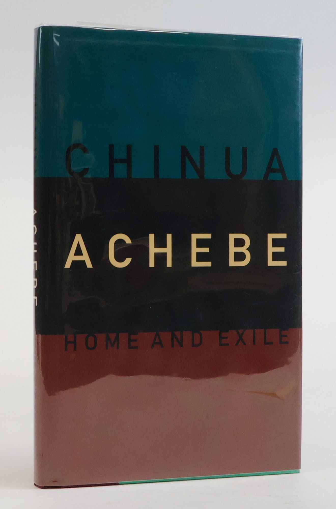 1385810 HOME AND EXILE [Signed]. Chinua Achebe.