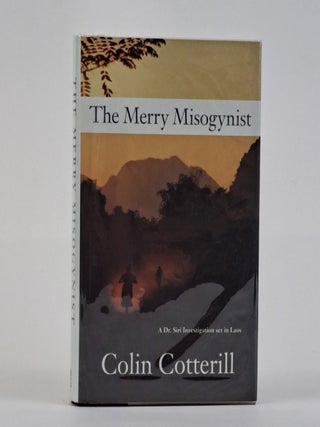 1390584 THE MERRY MISOGYNIST [Signed]. Colin Cotterill