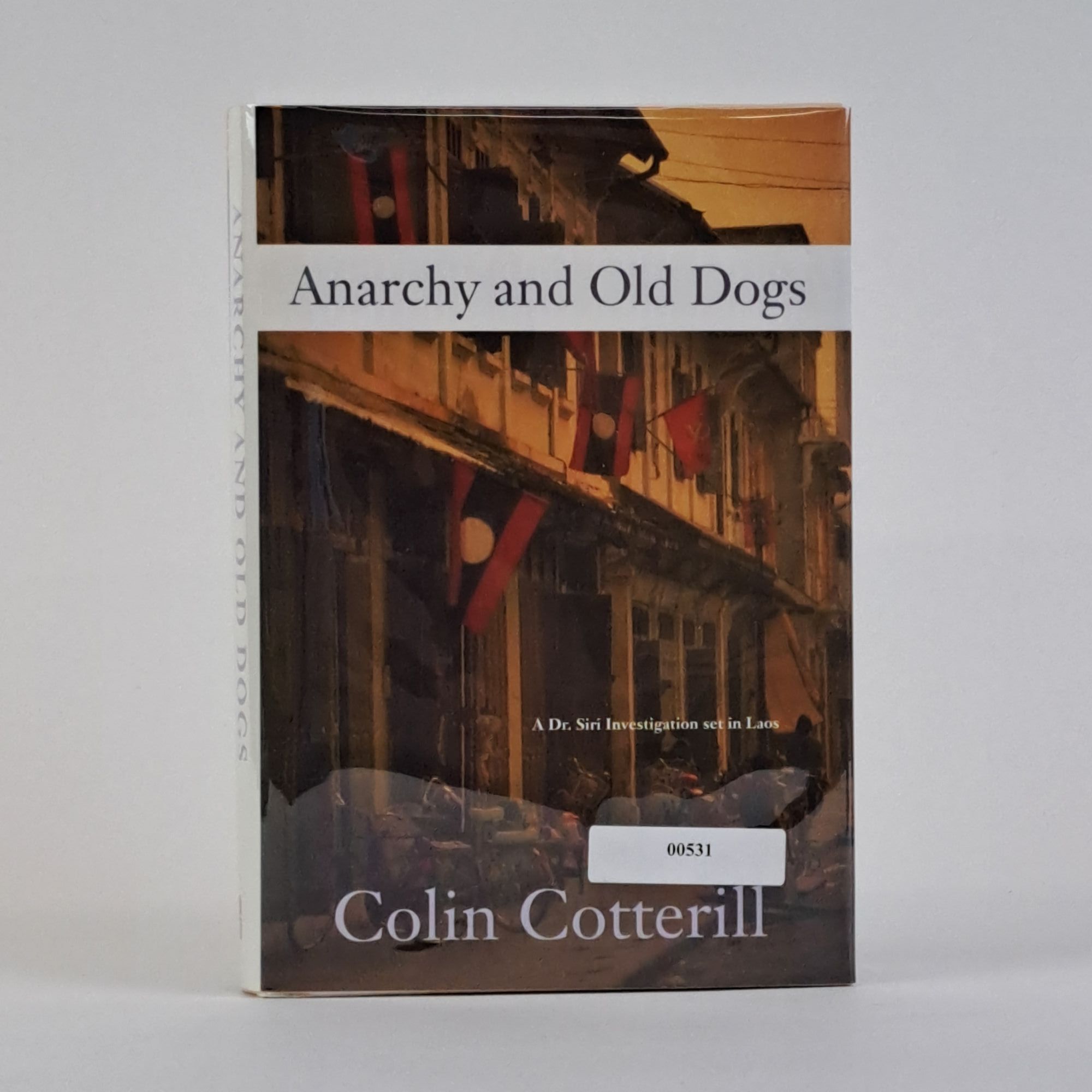 1390859 ANARCHY AND OLD DOGS [Signed]. Colin Cotterill.