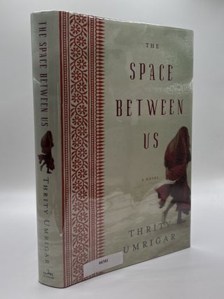 THE SPACE BETWEEN US [Signed. Thrity Umrigar.