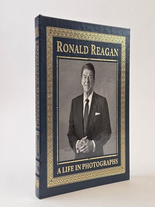 1405303 RONALD REAGAN; A LIFE IN PHOTOGRAPHS. David Elliot Cohen, Peter Robinson, Newt Gingrich,...