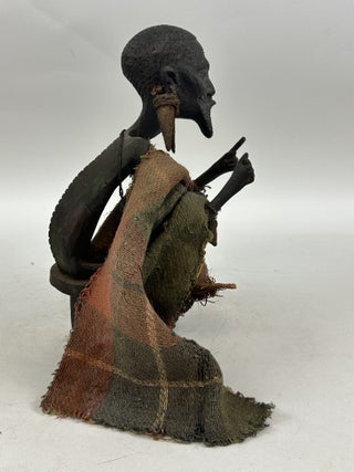 MAKONDE CARVED WOOD MALE FIGURE SEATED ON STOOL WITH FIBER CLOTH, KENYA