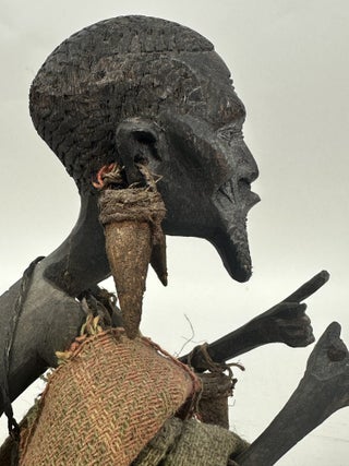 MAKONDE CARVED WOOD MALE FIGURE SEATED ON STOOL WITH FIBER CLOTH, KENYA