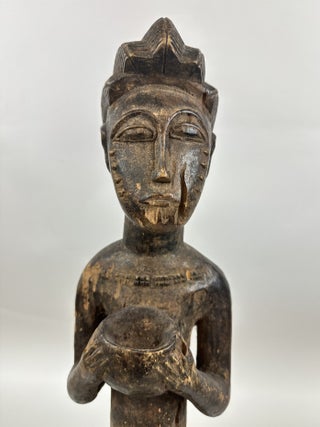 BAULE WOODEN MALE FIGURE HOLDING A BOWL, IVORY COAST