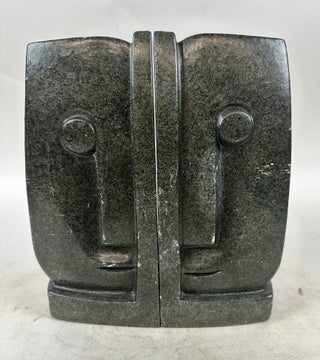 1413531 PAIR OF STONE BOOKENDS WITH ABSTRACT FACES, SOUTH AFRICA
