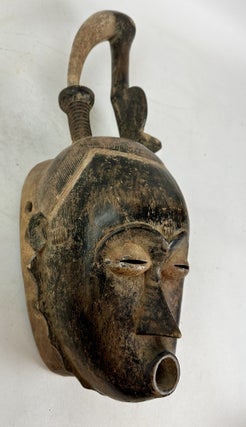 SENUFO WOODEN HELMET MASK WITH BIRD-BEAK, IVORY COAST