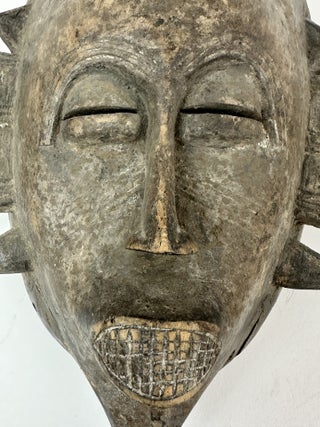 SENUFO KPELIE-TYPE WOODEN MASK, IVORY COAST