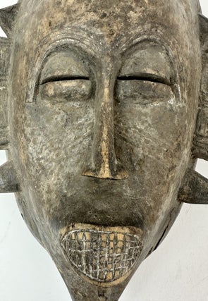 SENUFO KPELIE-TYPE WOODEN MASK, IVORY COAST